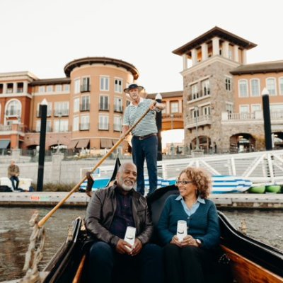 a group of people on a boat in the water